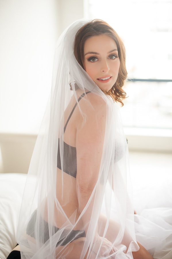 woman in bed with bridal veil